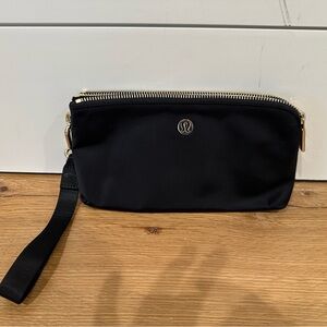 Lululemon Black Now and Always pouch with wrist strap.